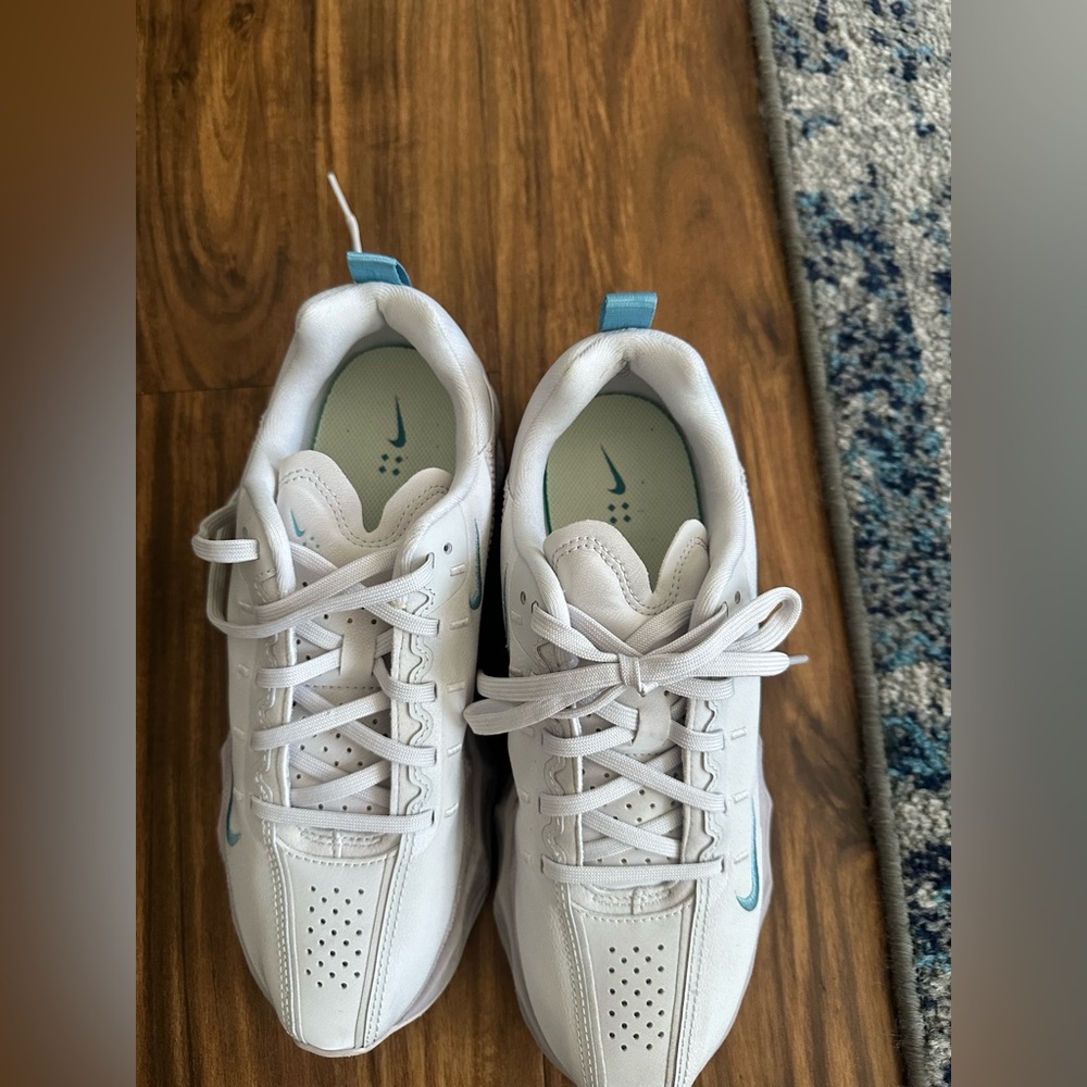 Nike women’s White Sneakers with Light Blue Accents. Light lavender